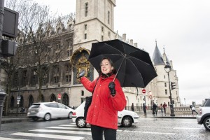 Rosemary Gestures toward the Tour de l'Horloge